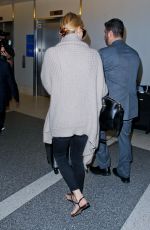 CHARLIZE THERON at Los Angeles International Airport 07/12/2015