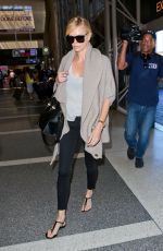 CHARLIZE THERON at Los Angeles International Airport 07/12/2015