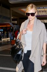 CHARLIZE THERON at Los Angeles International Airport 07/12/2015
