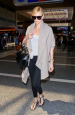 CHARLIZE THERON at Los Angeles International Airport 07/12/2015