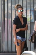 CHRISSY TEIGEN in Jeans Shorts Arriving at a Studio in Los Angeles 06/30/2015