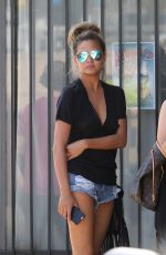 CHRISSY TEIGEN in Jeans Shorts Arriving at a Studio in Los Angeles 06/30/2015
