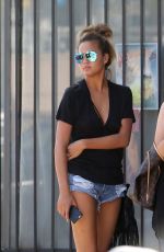 CHRISSY TEIGEN in Jeans Shorts Arriving at a Studio in Los Angeles 06/30/2015
