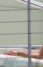 EVA LONGORIA in Bikini at a Pool at Her Hotel in Miami 06/30/2015