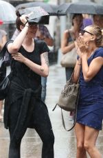 HAILEY and IRELAND BALDWIN Caught in the Rain in New York 07/30/2015