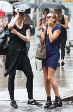 HAILEY and IRELAND BALDWIN Caught in the Rain in New York 07/30/2015