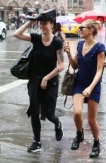 HAILEY and IRELAND BALDWIN Caught in the Rain in New York 07/30/2015