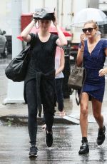 HAILEY and IRELAND BALDWIN Caught in the Rain in New York 07/30/2015