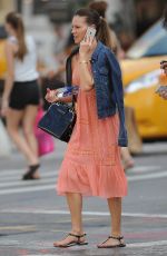 HILARY SWANK on the Phone Out in Chelsea 07/28/2015