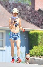 JULIETTE LEWIS in Bikini Top Walks Her Dog Out in Los Angeles 07/29/2015