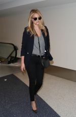 KATE UPTON arrives at LAX Airport n Los Angeles 07/27/2015