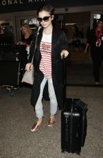 LILY COLLINS at Los Angeles International Airport 07/11/2015