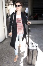 LILY COLLINS at Los Angeles International Airport 07/11/2015