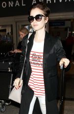 LILY COLLINS at Los Angeles International Airport 07/11/2015