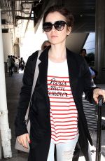 LILY COLLINS at Los Angeles International Airport 07/11/2015