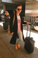LILY COLLINS at Los Angeles International Airport 07/11/2015