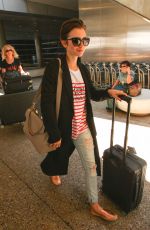 LILY COLLINS at Los Angeles International Airport 07/11/2015