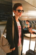 LILY COLLINS at Los Angeles International Airport 07/11/2015