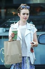 LILY COLLINS Leaves Earthbar in West Hollywood 07/19/2015