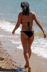 LISA MAFFIA in Bikini at a Beach in Essex