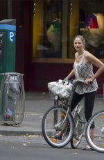 MIRA SORVINO Riding a Bike Out in Paris 07/04/2015
