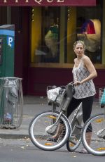 MIRA SORVINO Riding a Bike Out in Paris 07/04/2015