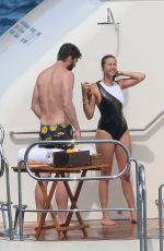 NINA DOBREV in a Black Swimsuit at a Boat in France 07/26/2015