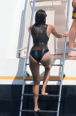 NINA DOBREV in a Black Swimsuit at a Boat in France 07/26/2015