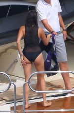 NINA DOBREV in a Black Swimsuit at a Boat in France 07/26/2015