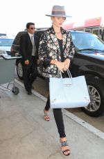 ROSIE HUNTINGTON-WHITELEY and Jason Statham at LAX Airport in Los Angeles 07/23/2015
