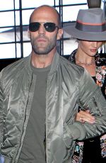 ROSIE HUNTINGTON-WHITELEY and Jason Statham at LAX Airport in Los Angeles 07/23/2015