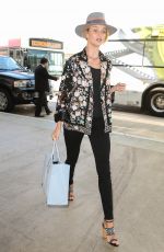ROSIE HUNTINGTON-WHITELEY and Jason Statham at LAX Airport in Los Angeles 07/23/2015