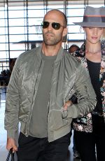 ROSIE HUNTINGTON-WHITELEY and Jason Statham at LAX Airport in Los Angeles 07/23/2015