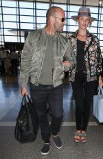 ROSIE HUNTINGTON-WHITELEY and Jason Statham at LAX Airport in Los Angeles 07/23/2015