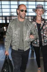 ROSIE HUNTINGTON-WHITELEY and Jason Statham at LAX Airport in Los Angeles 07/23/2015