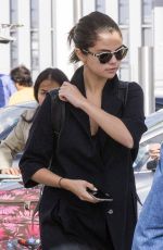 SELENA GOMEZ at Heathrow Airport in London 07/28/2015