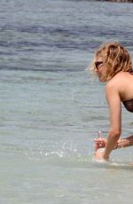 SIENNA MILLER in Bikini at a Beach in Formentera 07/03/2015