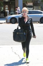 ASHLEY BENSON in tights Out And About in Los Angeles 08/13/2015
