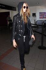 CARA DELEVINGNE Arrives at Los Angeles International Airport 08/28/2015