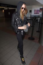 CARA DELEVINGNE Arrives at Los Angeles International Airport 08/28/2015