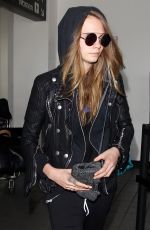 CARA DELEVINGNE Arrives at Los Angeles International Airport 08/28/2015