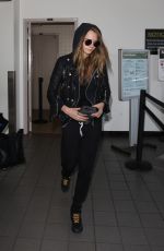 CARA DELEVINGNE Arrives at Los Angeles International Airport 08/28/2015