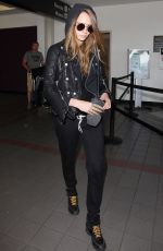 CARA DELEVINGNE Arrives at Los Angeles International Airport 08/28/2015