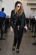 CARA DELEVINGNE Arrives at Los Angeles International Airport 08/28/2015