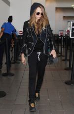 CARA DELEVINGNE Arrives at Los Angeles International Airport 08/28/2015