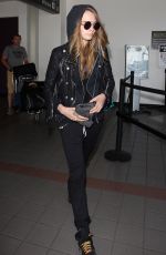 CARA DELEVINGNE Arrives at Los Angeles International Airport 08/28/2015