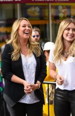 HILARY and HAYLIE DUFF in the Set of Extra