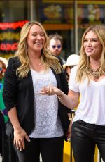 HILARY and HAYLIE DUFF in the Set of Extra