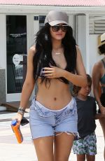 KYLIE JENNER in Bikini Top Arrives at a Boat
