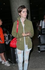 LILY COLLINS Arrives at LAX Airport in Los Angeles 08/12/2015